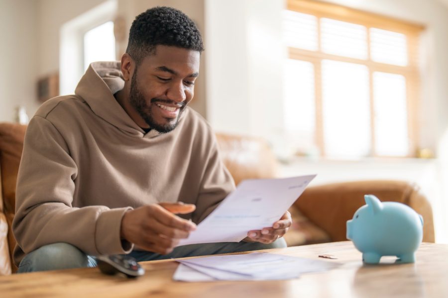 A young professional is building an emergency fund for financial security.