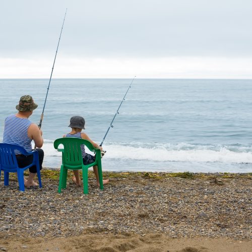 A 60-year-old man and his grandson go fishing together.