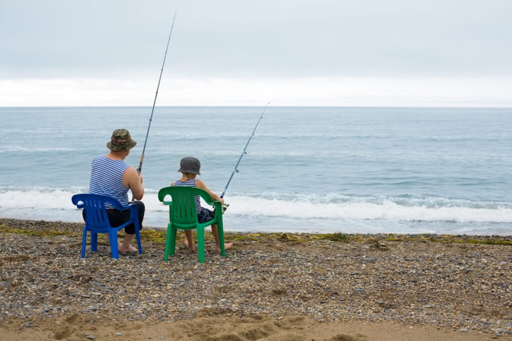 A 60-year-old man and his grandson go fishing together.